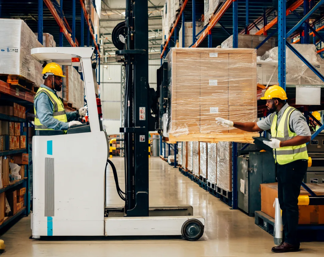 professional-warehouse-worker-moving-cardboard-box-2024-10-10-23-29-06-utc